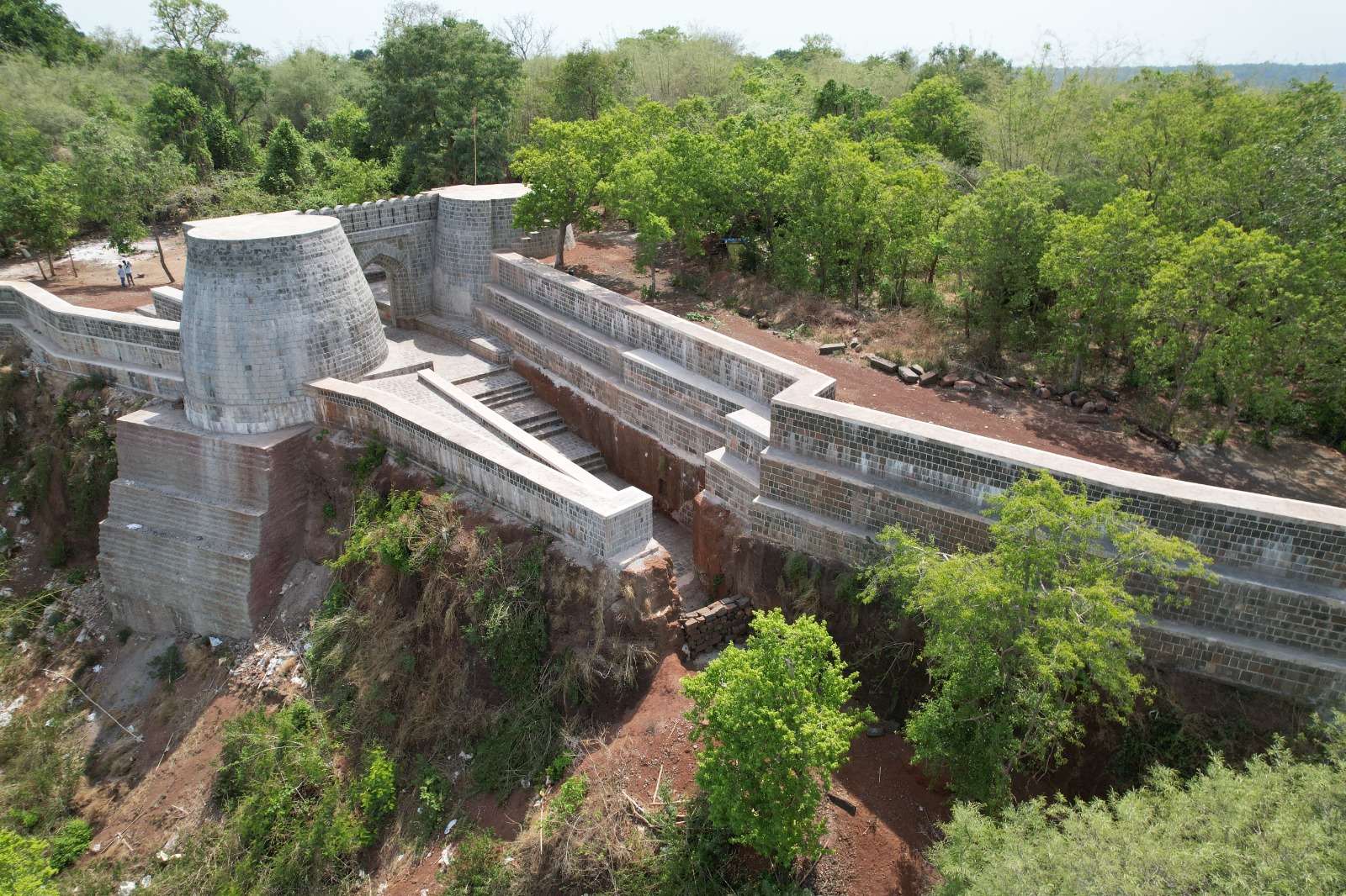 Aerial view of the restored ramparts and gateway of Manikgad Fort