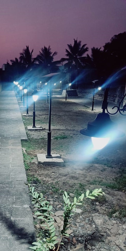 Solar lights installed along a heritage site pathway at night